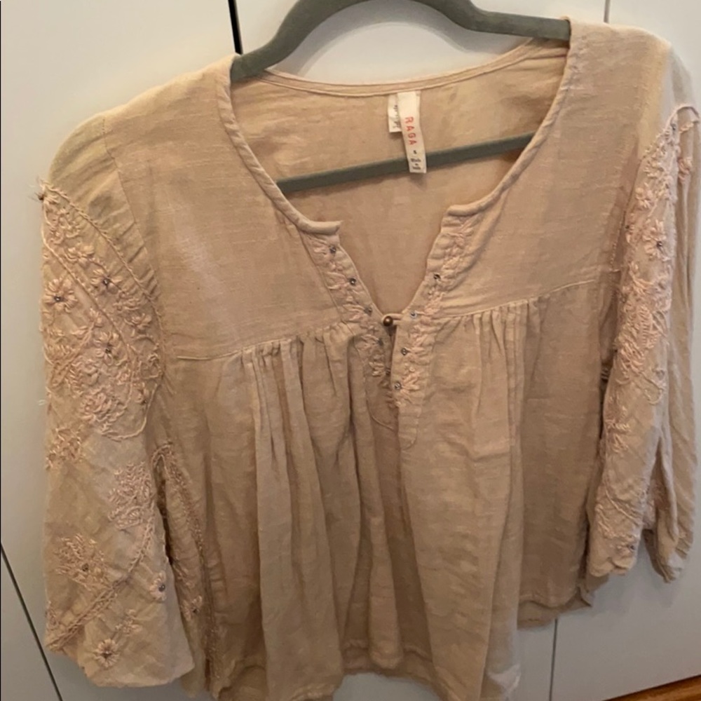 A super cute beige woman’s blouse